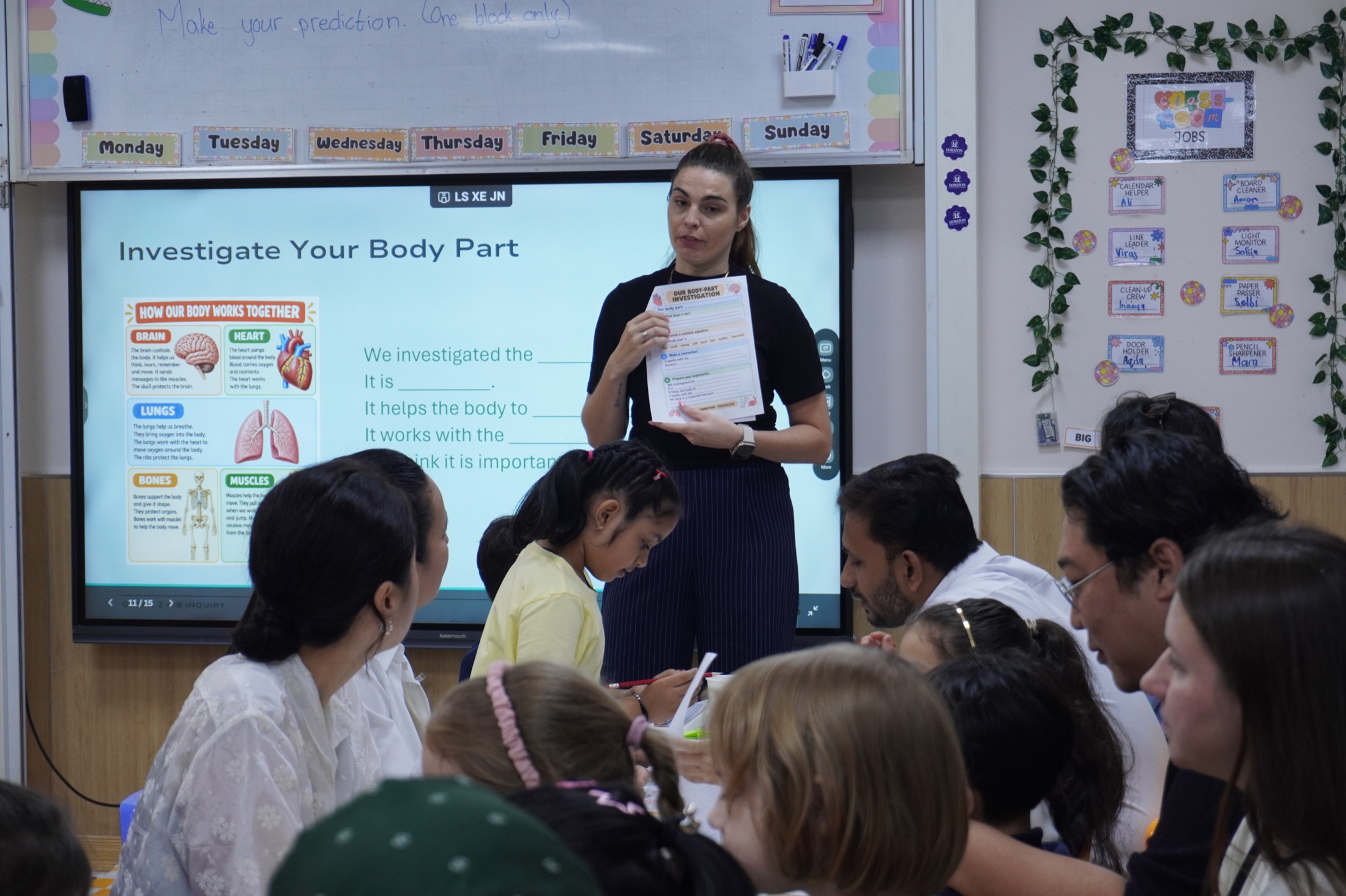 A Horizon teacher leading a PYP learning activity with students and families