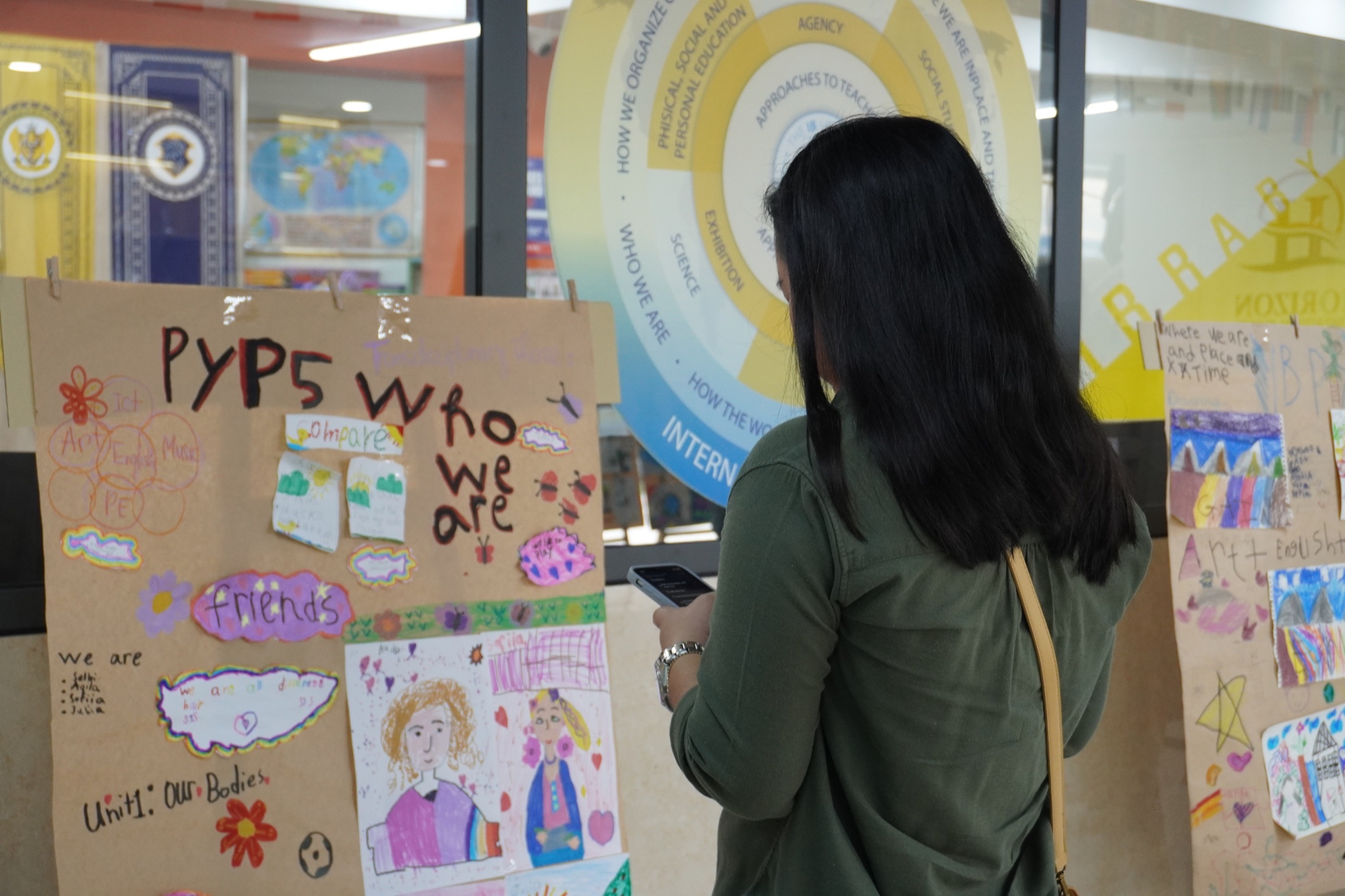 A visitor viewing a Horizon PYP student exhibition